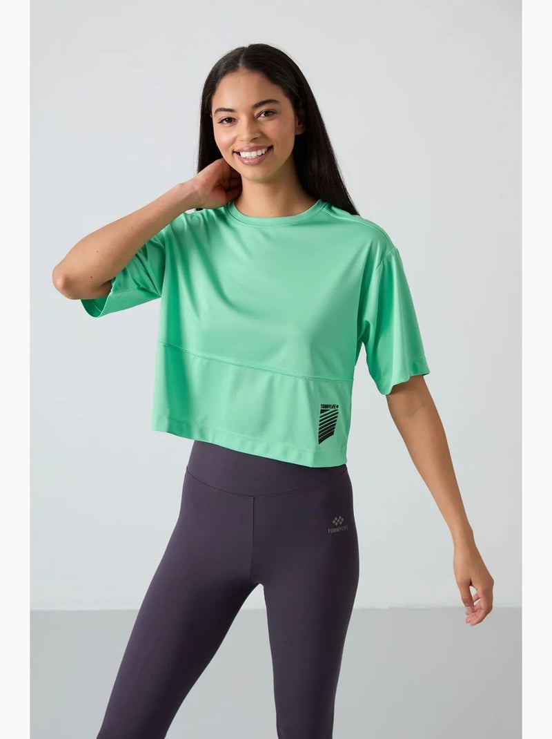 T-shirt oversize con collo rotondo e tasca tommy Verde menta - Kiabi