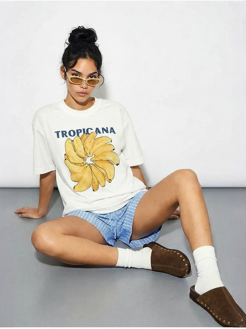 T-shirt oversize con girocollo e stampa lucci Bianco - Kiabi