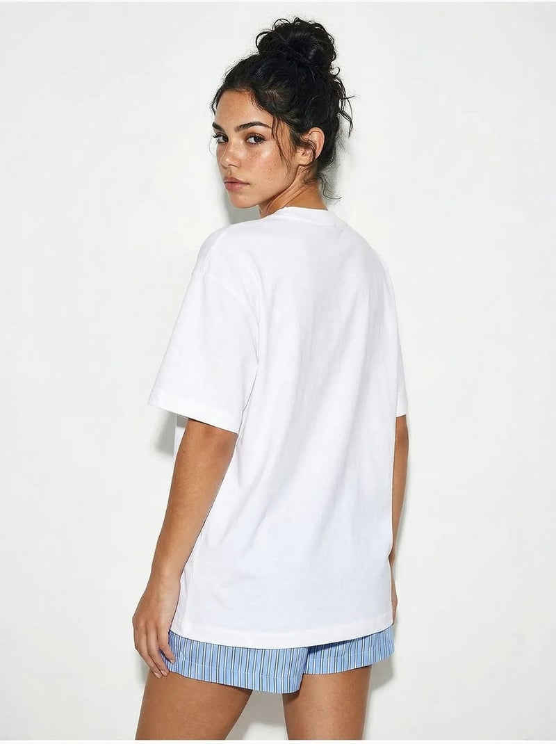 T-shirt oversize con girocollo e stampa lucci Bianco - Kiabi