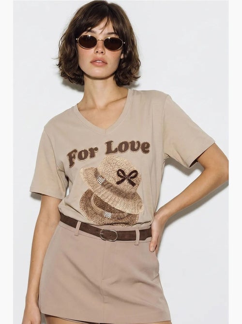 T-shirt oversize con scollo a v e stampa lucci - Kiabi T-shirt oversize con scollo a v e stampa lucci - Kiabi
