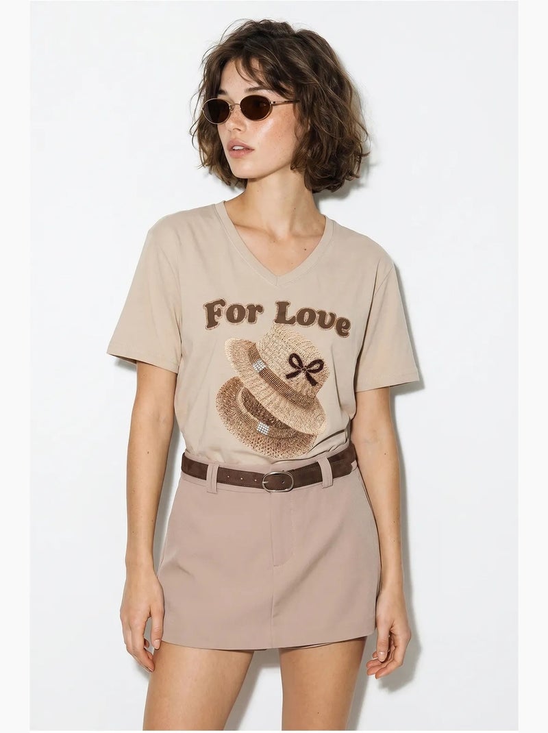 T-shirt oversize con scollo a v e stampa lucci Beige argilla - Kiabi