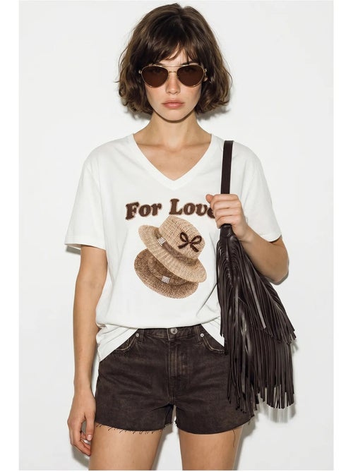 T-shirt oversize con scollo a v e stampa lucci - Kiabi T-shirt oversize con scollo a v e stampa lucci - Kiabi