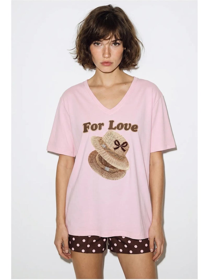 T-shirt oversize con scollo a v e stampa lucci Rosa chiaro - Kiabi