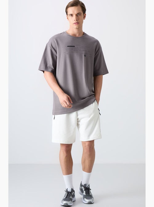 T-shirt oversize con stampa e girocollo tommy - Kiabi