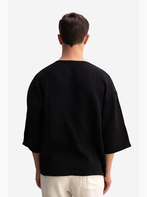 T-shirt oversize in cotone con girocollo giesto - Kiabi T-shirt oversize in cotone con girocollo giesto - Kiabi