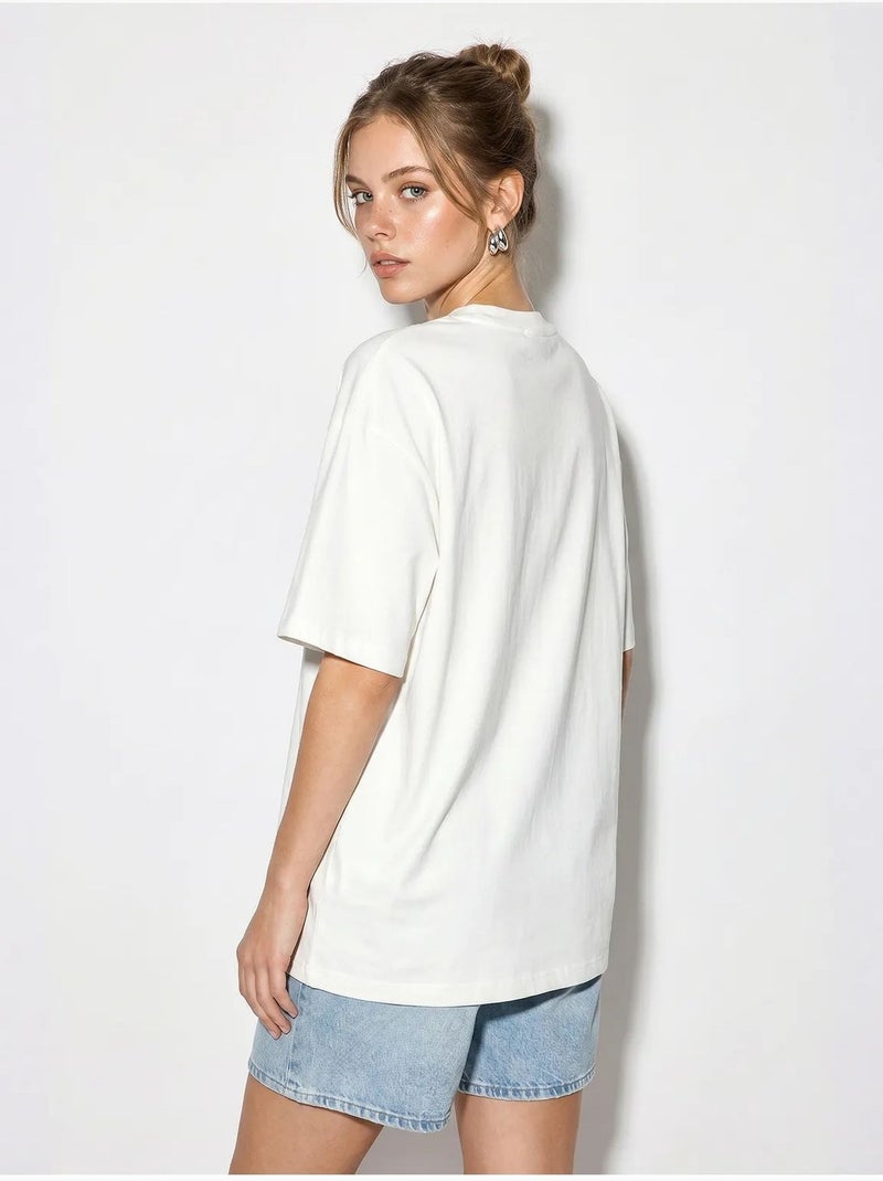 T-shirt oversize in cotone con stella di paillettes lucci Bianco sporco - Kiabi