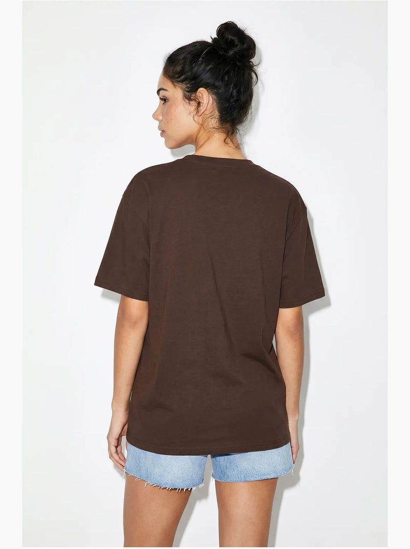 T-shirt oversize in jersey di cotone stampata lucci Marrone - Kiabi