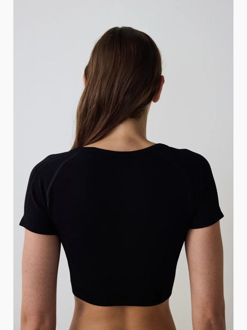 T-shirt sportiva corta manica corta senza cuciture aderente penti - Kiabi T-shirt sportiva corta manica corta senza cuciture aderente penti - Kiabi