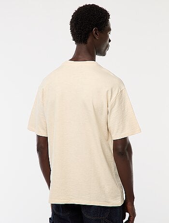 T-shirt tinta unita a maniche corte con tasca sul petto