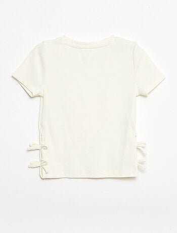 T-shirt tinta unita con fiocchi decorativi