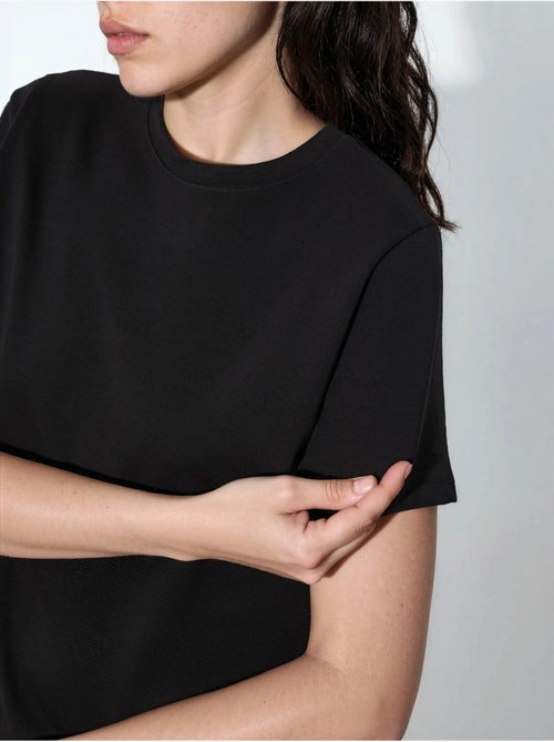 T-shirt tinta unita con girocollo busem - Kiabi T-shirt tinta unita con girocollo busem - Kiabi