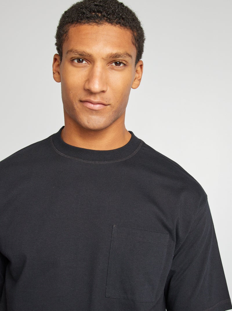 T-shirt tinta unita con taschino nero - Kiabi