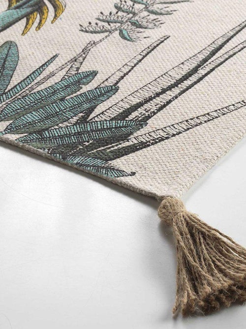 Tappeto con stampa di fogliame esotico e pompon - Kiabi Tappeto con stampa di fogliame esotico e pompon - Kiabi