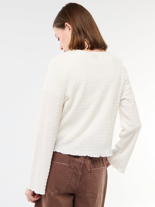 Top a collo a V in maglia goffrata con bottoni dorati - Kiabi