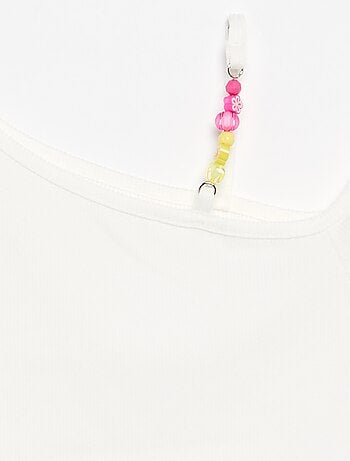 Top a costine con scollo asimmetrico