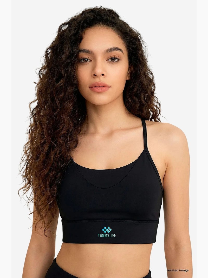 Top active da donna in poliestere ed elastan tommy Nero - Kiabi