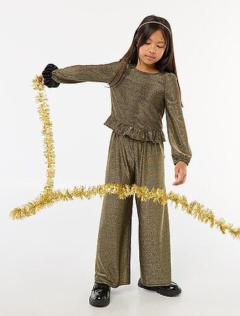 Top brillante in maglia con volant e motivo a baci