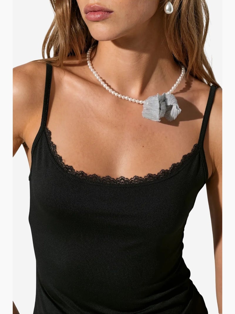 Top cami corto aderente in pizzo busem Nero - Kiabi