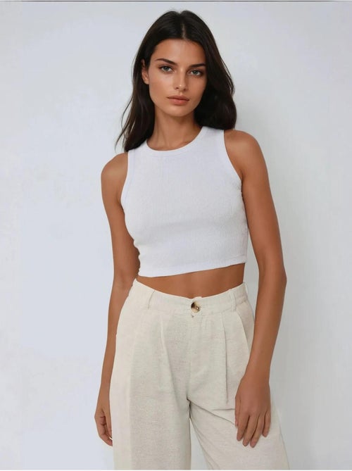Top corto in maglia a coste senza maniche con scollo a girocollo hiccup - Kiabi Top corto in maglia a coste senza maniche con scollo a girocollo hiccup - Kiabi