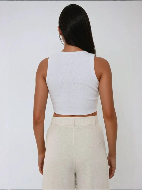 Top corto in maglia a coste senza maniche con scollo a girocollo hiccup - Kiabi Top corto in maglia a coste senza maniche con scollo a girocollo hiccup - Kiabi
