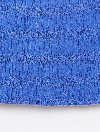 Top cropped con spalline