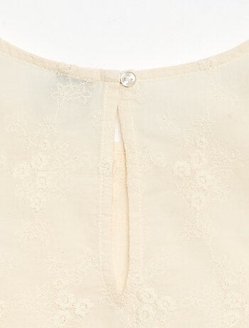 Top senza maniche con ricamo all over