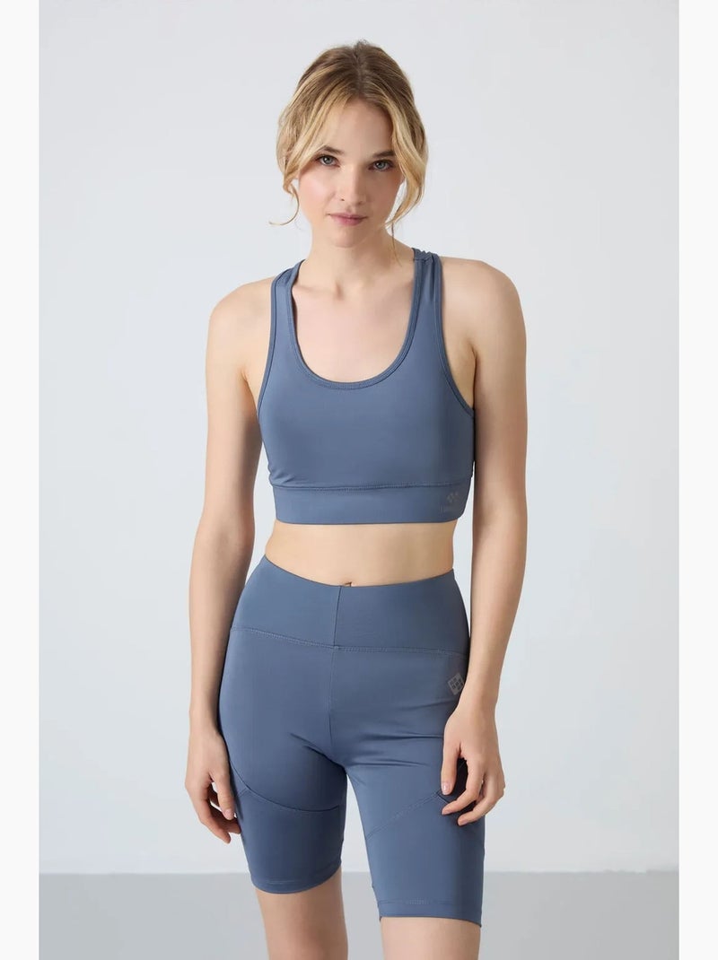 Top sportivo corto aderente senza maniche tommy Blu - Kiabi