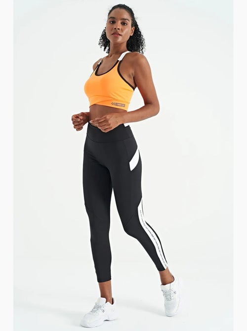 Top sportivo crop aderente senza maniche tommy - Kiabi