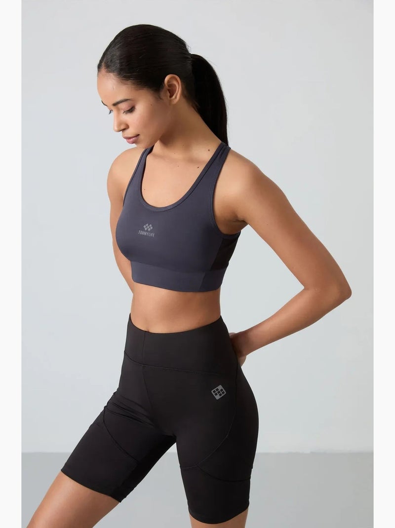 Top sportivo crop aderente senza maniche tommy Blu - Kiabi