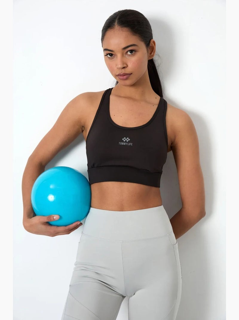 Top sportivo crop aderente senza maniche tommy Nero - Kiabi