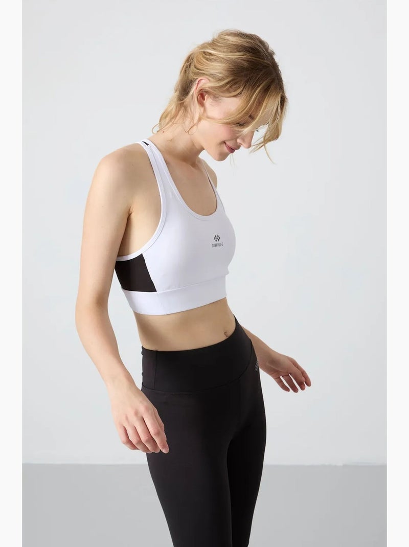 Top sportivo crop aderente senza maniche tommy Nero - Kiabi