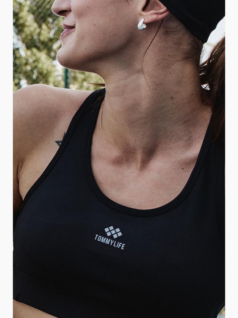 Top sportivo crop senza maniche aderente tommy Nero - Kiabi