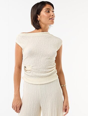 Top stretch asimmetrico a tinta unita senza maniche