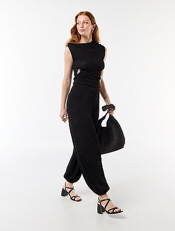 Top stretch asimmetrico a tinta unita senza maniche