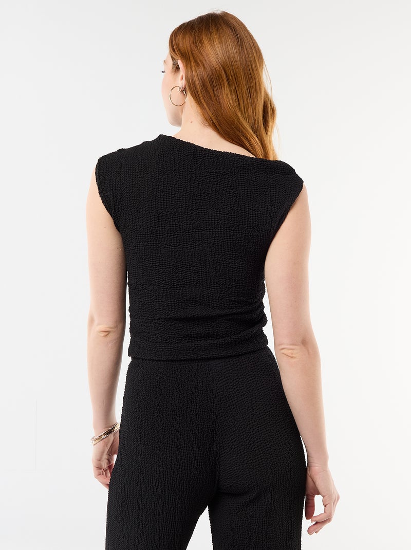 Top stretch asimmetrico a tinta unita senza maniche Nero - Kiabi