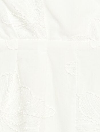 Tuta corta con grandi fiori ricamati