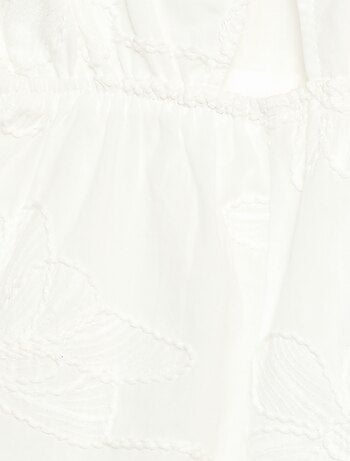 Tuta corta con grandi fiori ricamati