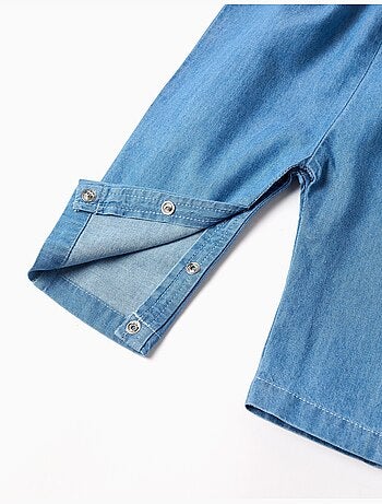 Tuta in denim con fiori ricamati