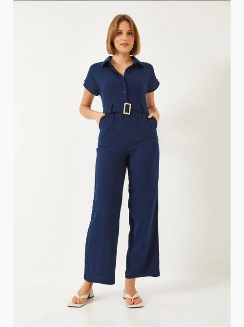 Tuta lunga in popeline con colletto a camicia e chiusura con bottoni lucci - Kiabi Tuta lunga in popeline con colletto a camicia e chiusura con bottoni lucci - Kiabi
