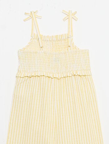 Tuta pantalone con bretelle