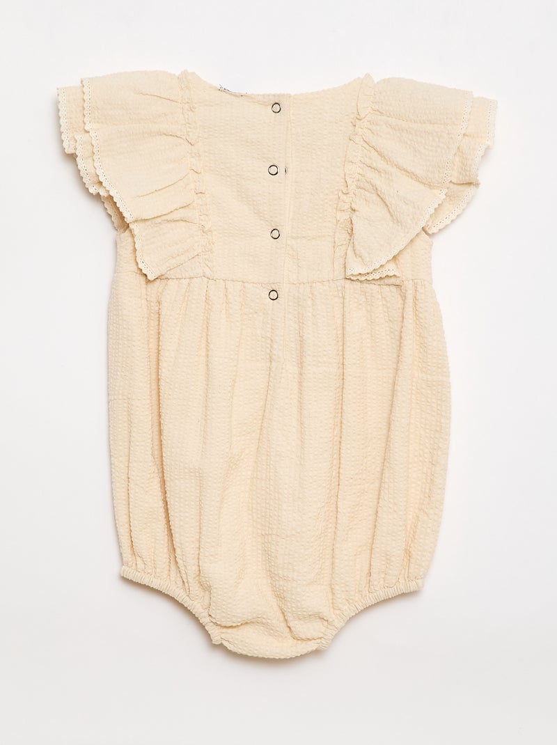 Tutina con tessuto effetto goffrato e volant Beige - Kiabi