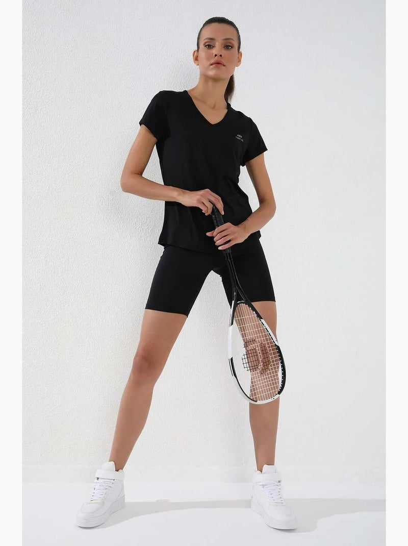 Women's t-shirt tinta unita con scollo a v e maniche corte tommy Nero - Kiabi