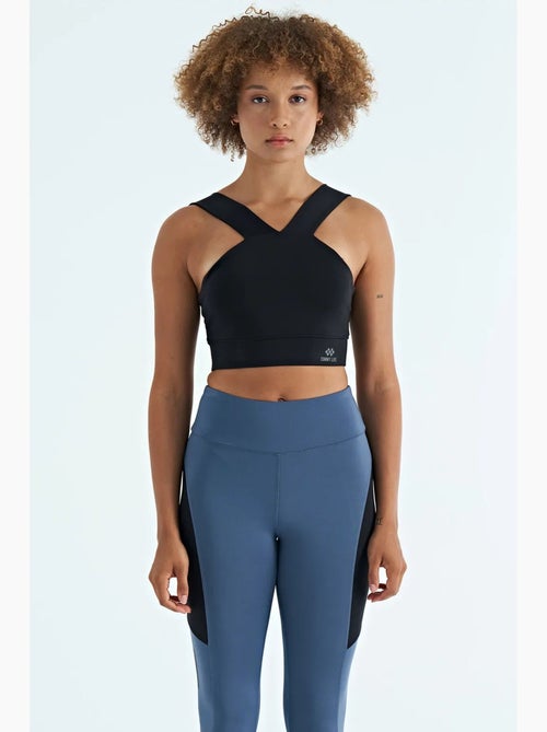 Women's top sportivo corto aderente senza maniche con scollo a v tommy - Kiabi Women's top sportivo corto aderente senza maniche con scollo a v tommy - Kiabi