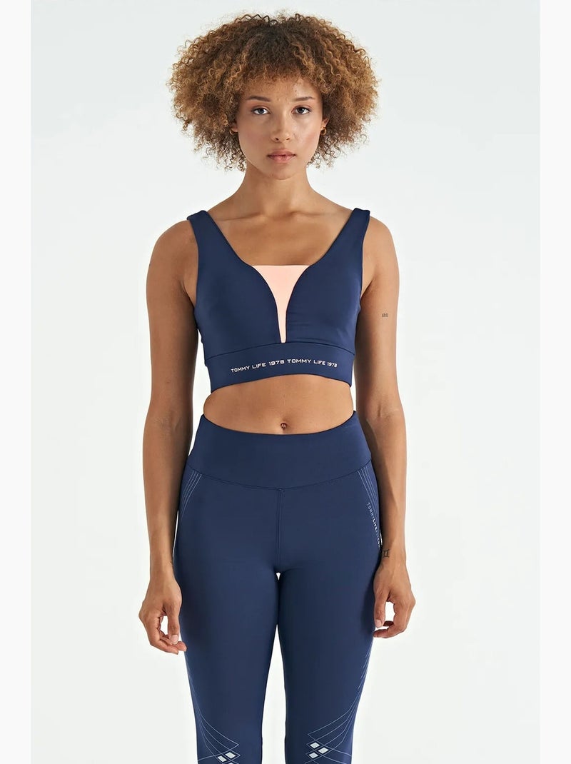Women's top sportivo corto senza maniche a blocchi di colore tommy Blu Rosa - Kiabi