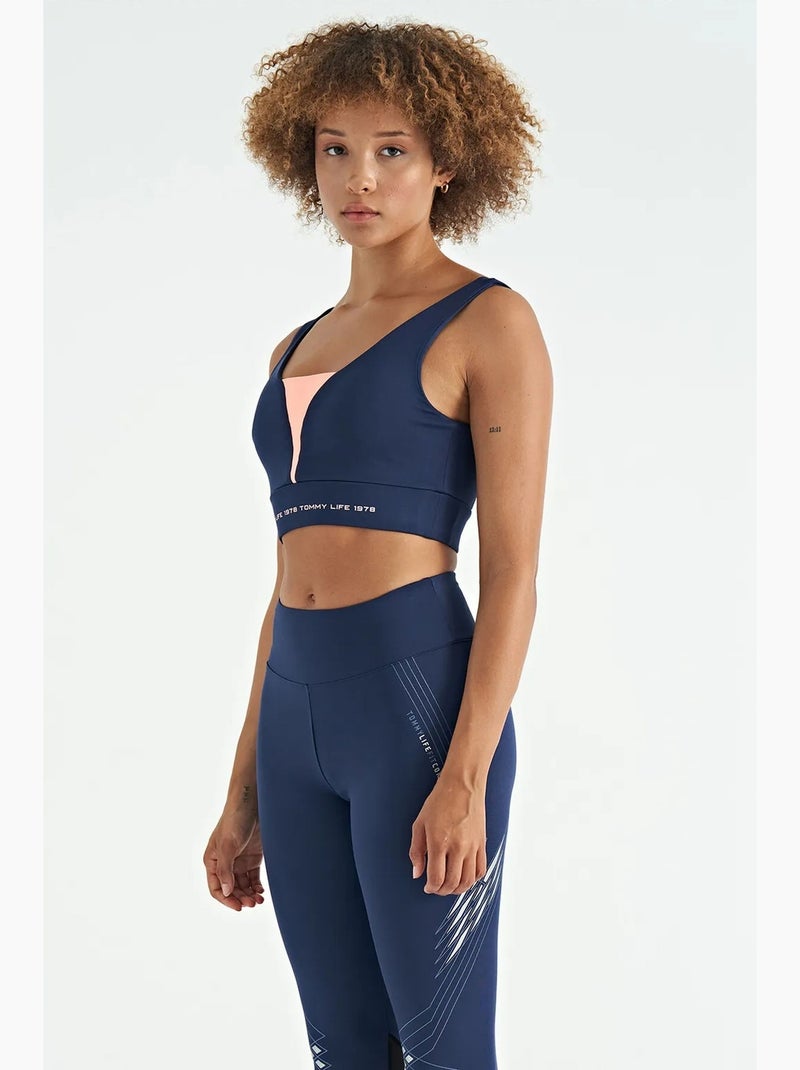 Women's top sportivo corto senza maniche a blocchi di colore tommy Blu Rosa - Kiabi